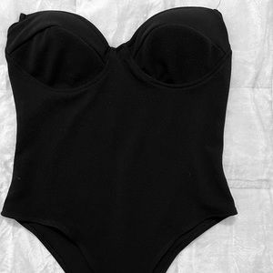 Shien strapless black body suit.